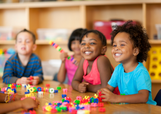 smiling students at table