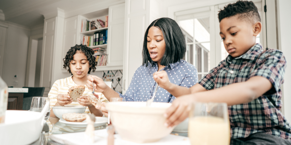 Family eating breakfast together