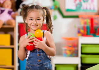 mother with preschool daughter playing